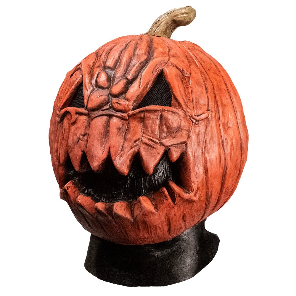 Mask, left side view. Head and neck. Angry jack o' lantern face, black neck.