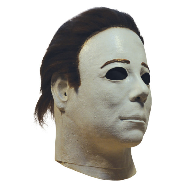 Right side view, mask, head and neck. White skin, dark brown hair.