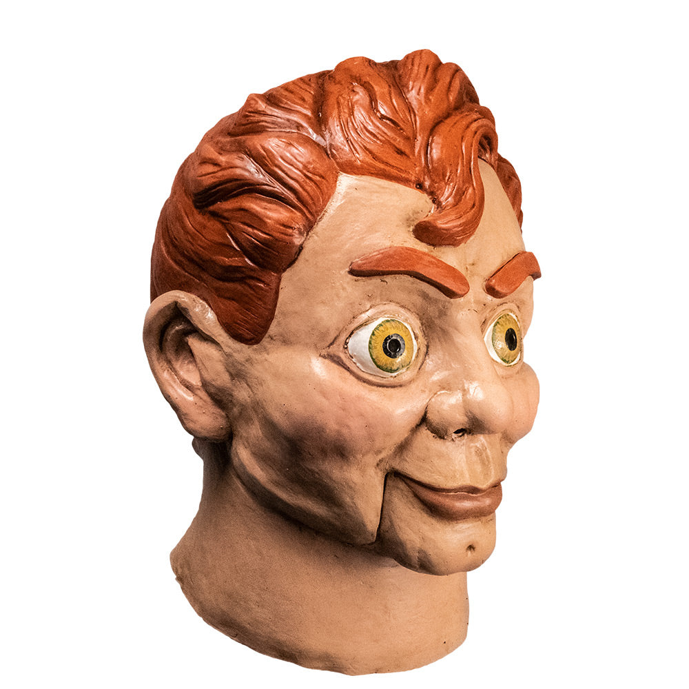 Ventriloquist dummy mask right side view. Head and neck. Red hair and eyebrows, large yellow green eyes