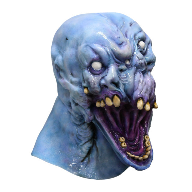 Right side view. Gray Matter Mask, head and neck. Grey blue distorted head, many white eyes, several misplaced yellow upper teeth, Large gaping grotesque mouth, with lower jaw of human-like teeth.