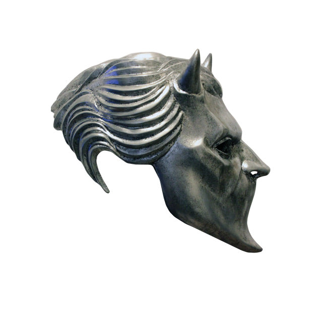 Right side view. Chrome colored resin mask. male face, 2 horns on forehead. Blank spot where mouth would be.