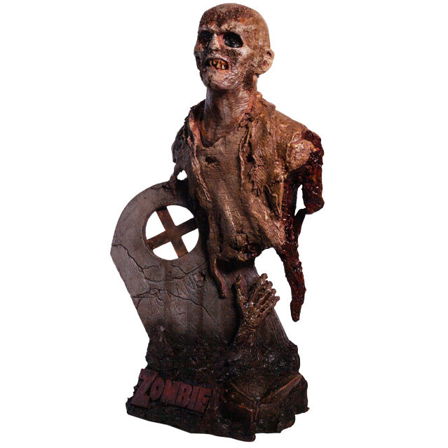 Bust, left view. Rotted zombie head neck and upper torso, wearing dirty rotted torn clothing. Gore around shoulders and bottom of torso. Face has rotting flesh, black eyes, mouth of jagged dirty teeth. Base is gravestone set in soil, with zombie arm coming from the ground , plaque at bottom with red text reading Zombie.