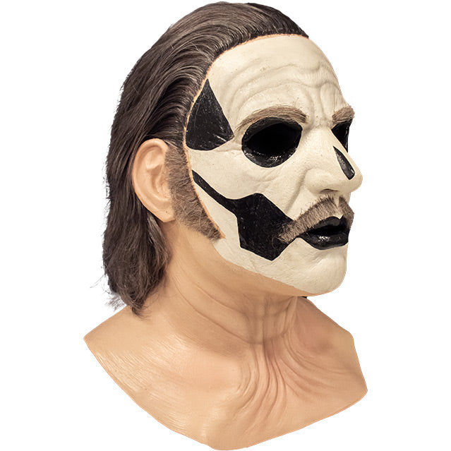 Mask, right side view. Head, neck and upper chest. Thick black and gray hair, gray eyebrows, moustache and sideburns, white painted face, with black accents to create skull like appearance.