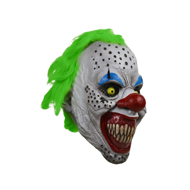 right side view. Scary Clown face. Bright green hair, white skin with black holes, black ringed yellow eyes with blue eyebrows, large bright red nose, large red clown mouth smiling with large sharp teeth.