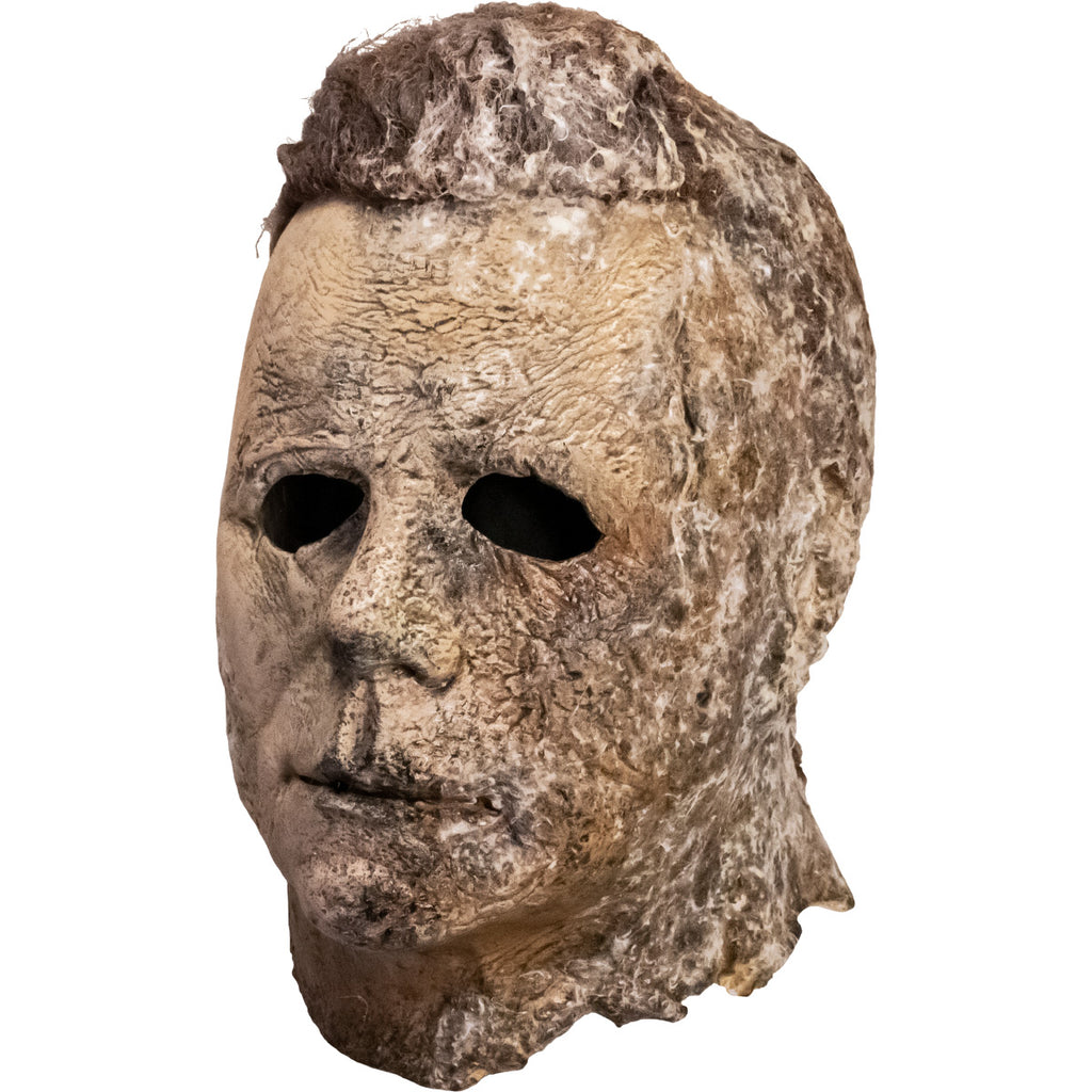 Left view. Mask, head and neck. Brown hair, weathered, dirty moldy skin.