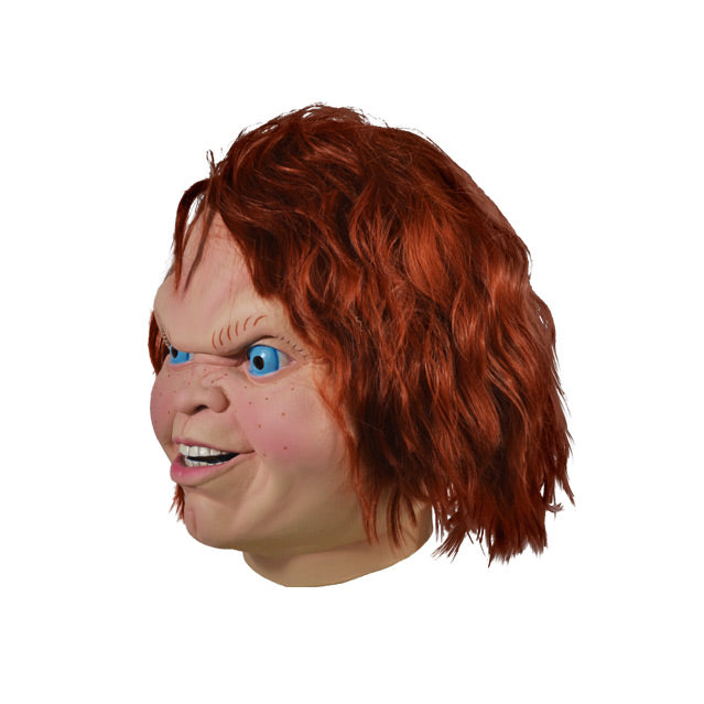 Left side view. Evil Chucky Mask. Head and neck. Red Hair blue eyes, freckles, cleft chin, sneering face.