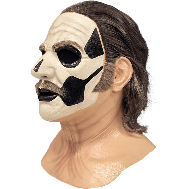 Mask, left side view. Head, neck and upper chest. Thick black and gray hair, gray eyebrows, moustache and sideburns, white painted face, with black accents to create skull like appearance.