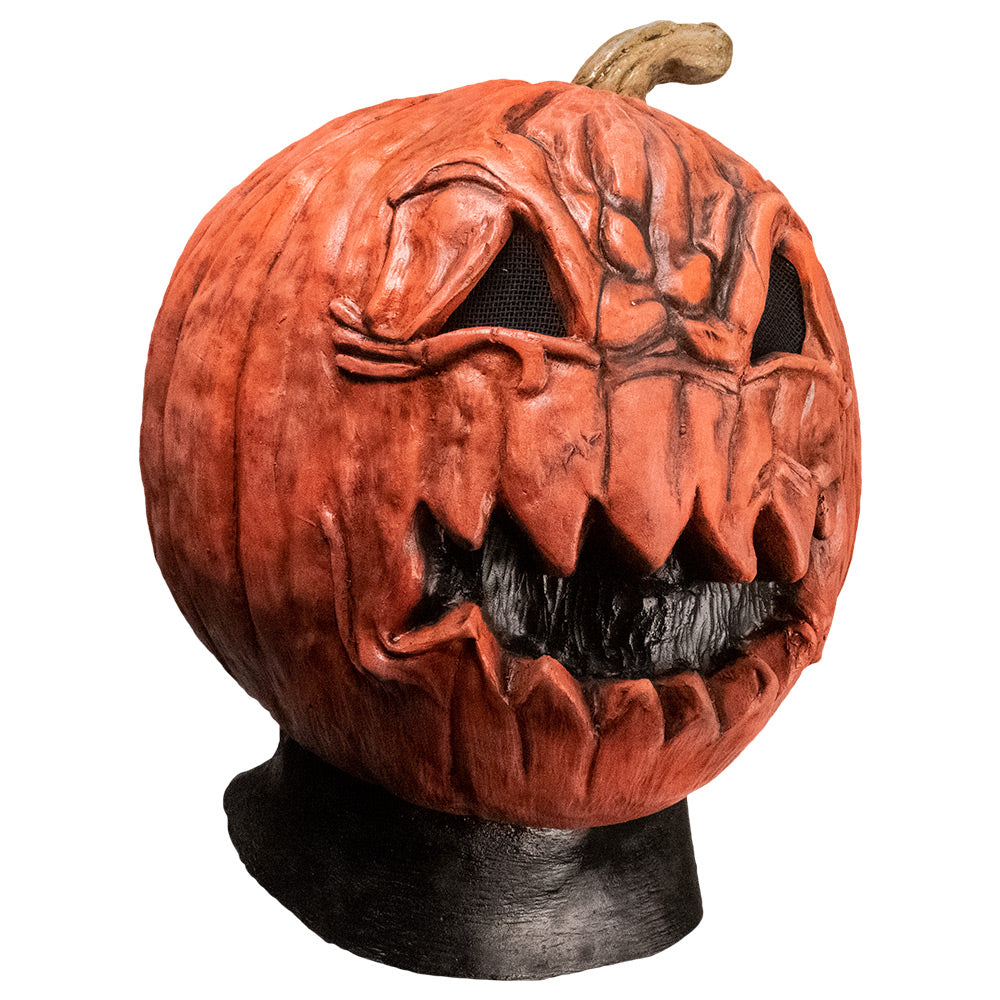 Mask, right side view. Head and neck. Angry jack o' lantern face, black neck.