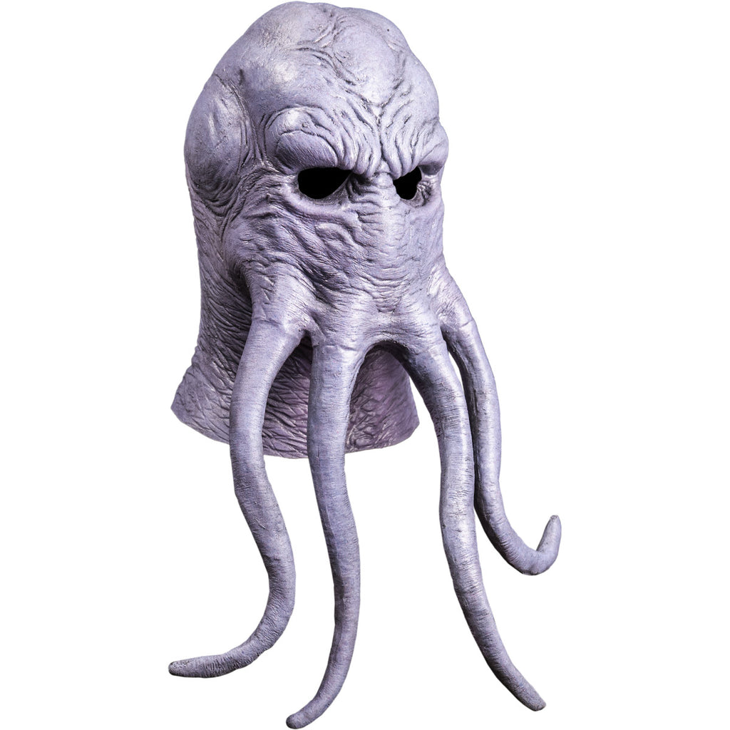 Mask, right side view, head and neck. Lumpy octopus-like head, wrinkled gray flesh. Four long tentacles extending from middle of face.