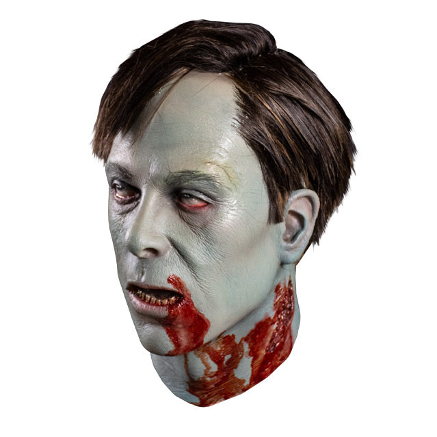 Left side view. Flyboy mask, head and neck. Short brown hair, gray skin, red rimmed eyes, slack jaw open mouth showing bloody teeth and tongue. Blood on left side of mouth chin and neck, large wound on neck under left ear.