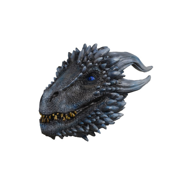 Left side view. Dragon mask. Gray dragon face. Bright blue eyes. Many light gray spikes. Mouth with several sharp yellow teeth.