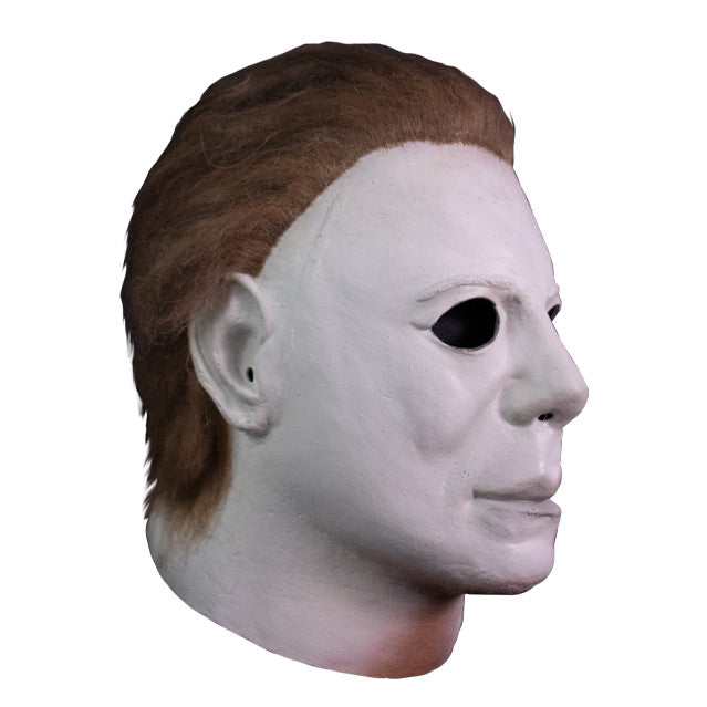 Right side view, mask, head and neck. White skin, dark brown hair.