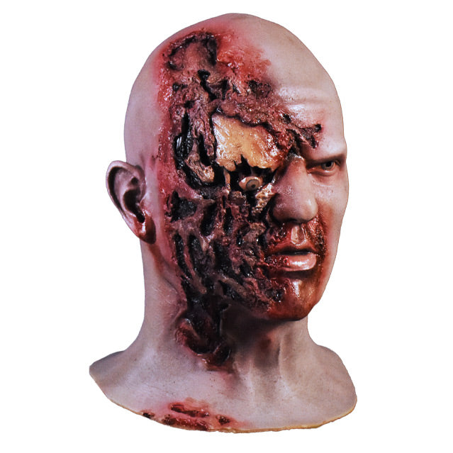 Right side view. Airport Zombie mask. Head and neck. Bald zombie, right side of face and neck is gory, right eye is misplaced and hanging.