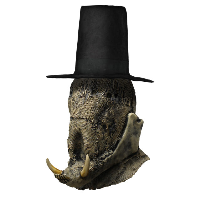 Left side view. Scarecrow mask head and neck. Burlap textured face. Non-descript upper facial features, prominent lower jaw with 2 large tusks. Wearing tall black hat.