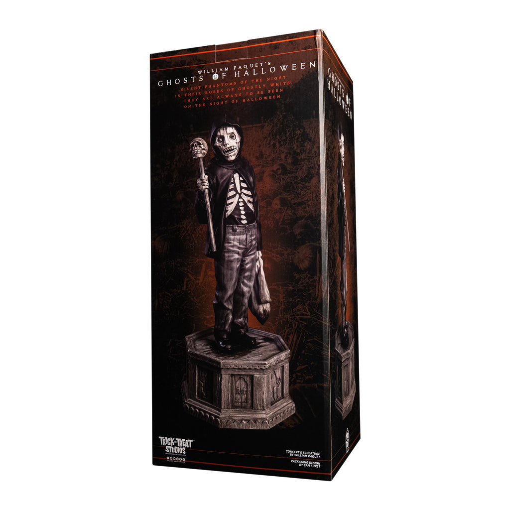 Product packaging, Back of box, text reads Ghosts of Halloween. Grayscale, Boy with skeletal face, wearing black hooded jacket over black skeleton shirt, jeans. Holding baton topped with skull in right hand, holding dirty sack in left hand. black shoes. Holding baton topped with skull in right hand, holding dirty sack in left hand. Standing on hexagon base made of gravestones.