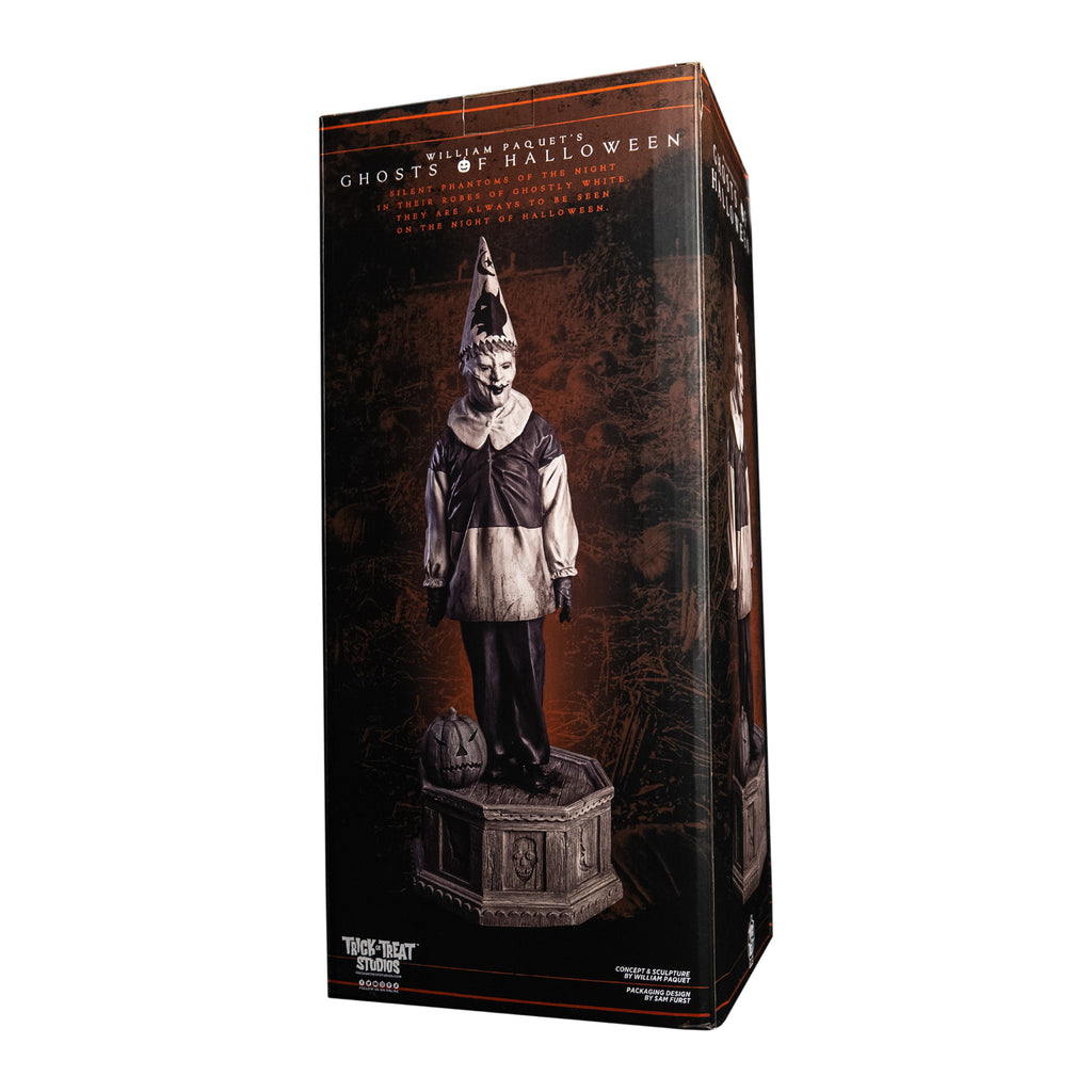 Product packaging, back of box, text reads Ghosts of Halloween. Grayscale, Creepy clown, tall pointy hat, black and white shirt with large white collar, black pants, shoes and gloves. Standing next to jack o' lantern on hexagon base made of gravestones