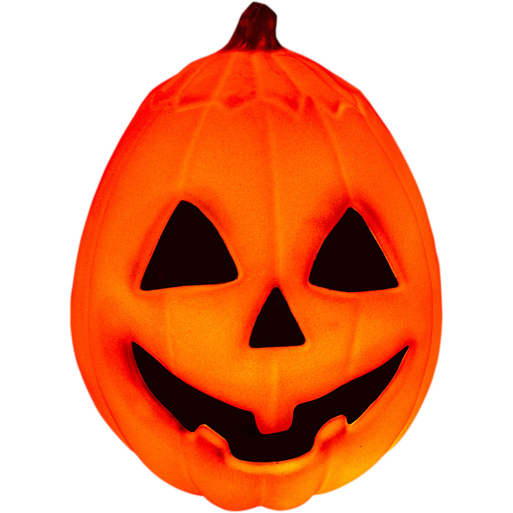 Lit Pumpkin prop, front view. Orange jack o' lantern, green stem, black triangle eyes and nose, grinning black mouth. On white background.