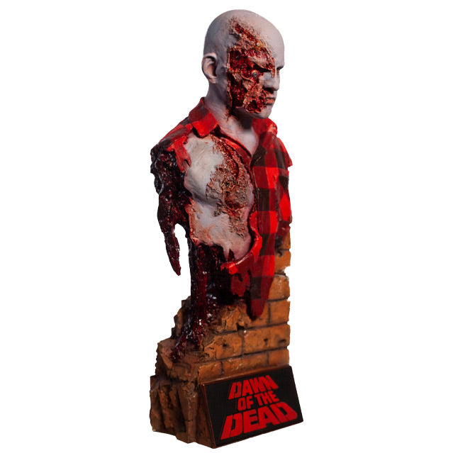 Right side view. Airport Zombie bust. Head shoulders and upper torso. Bald zombie, right side of face and chest is gory, wearing torn red and black flannel shirt. Base of bust is a broken brick wall, plaque at bottom, red text reads Dawn of the Dead.