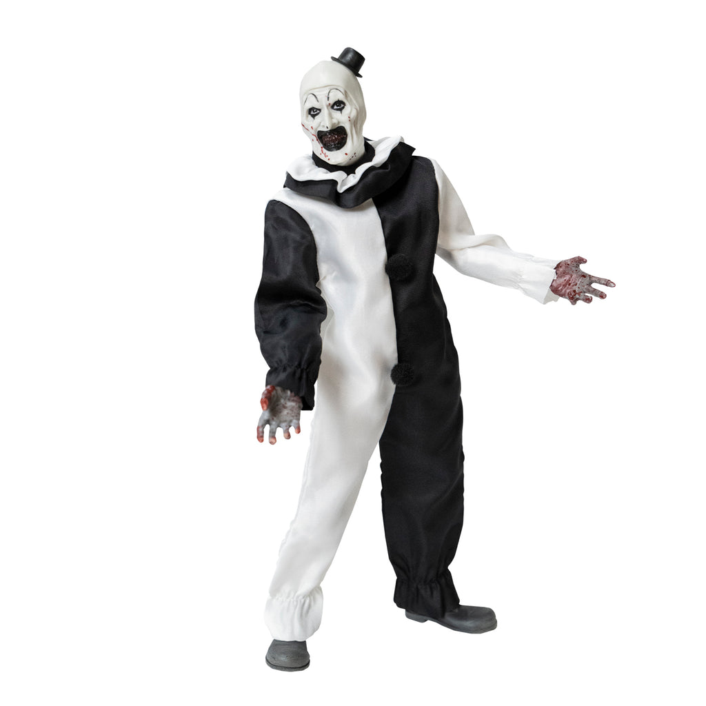 Terrifier, 1/6 scale figure, right side view. Evil grinning clown face with tiny black top hat, black and white, jumpsuit, ruffle at neck, fingerless white gloves, dark gray shoes. Blood spatter on face and hands.