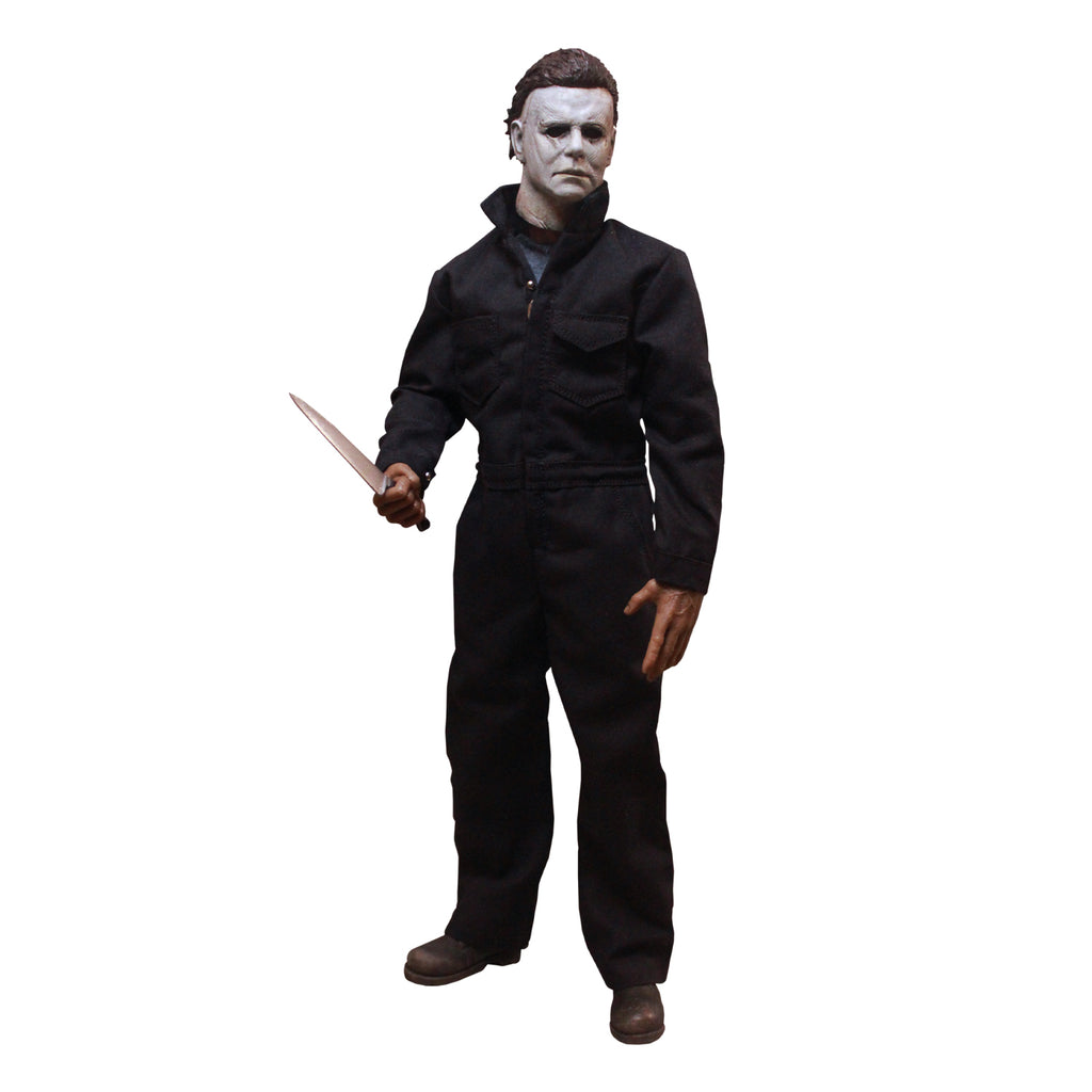 Halloween 2018 Michael Myers 12" figure. White mask brown hair, wearing dark coveralls, black boots, holding butcher knife in right hand.