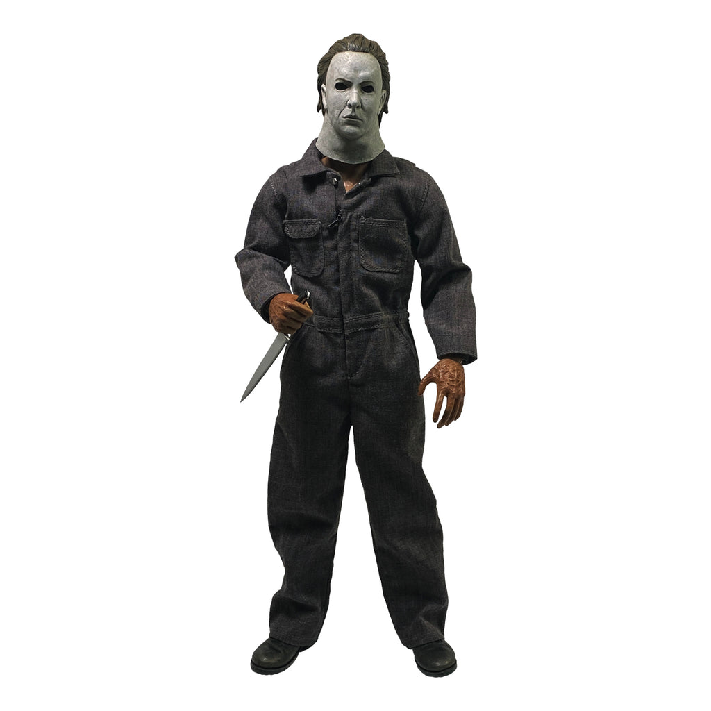 Front view. Halloween 5 Michael Myers 12" figure. White mask brown hair, wearing coveralls, black boots, holding butcher knife in right hand.