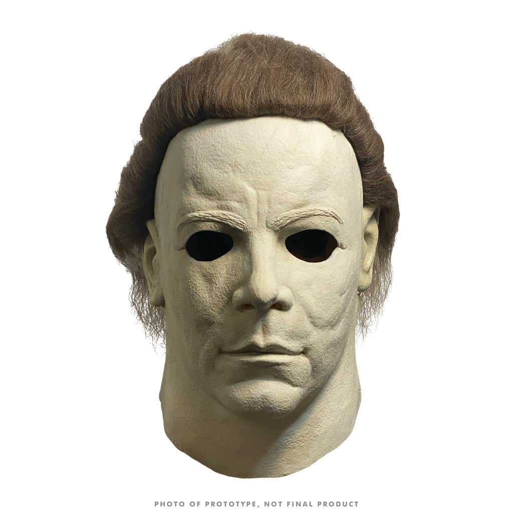 Mask, head and neck, front view. Brown hair, pale white skin.