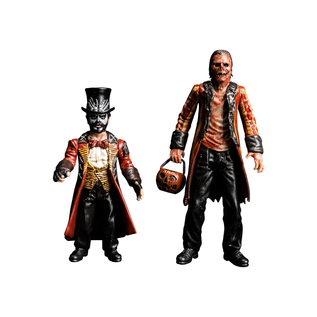 Candy Corn action figures.  Left, Dr. Death, Small man, black top hat, white face, full beard. wearing long red and black coat, white shirt, yellow and black striped vest, red bowtie, black pants, black boots, black fingerless gloves.  Right, tall man with gory orange Jack O' Lantern-like face.  Wearing a blood-stained shirt, red and orange striped coat with black cuffs and sleeves, black pants, black boots.  Holding orange jack o' lantern candy pail.