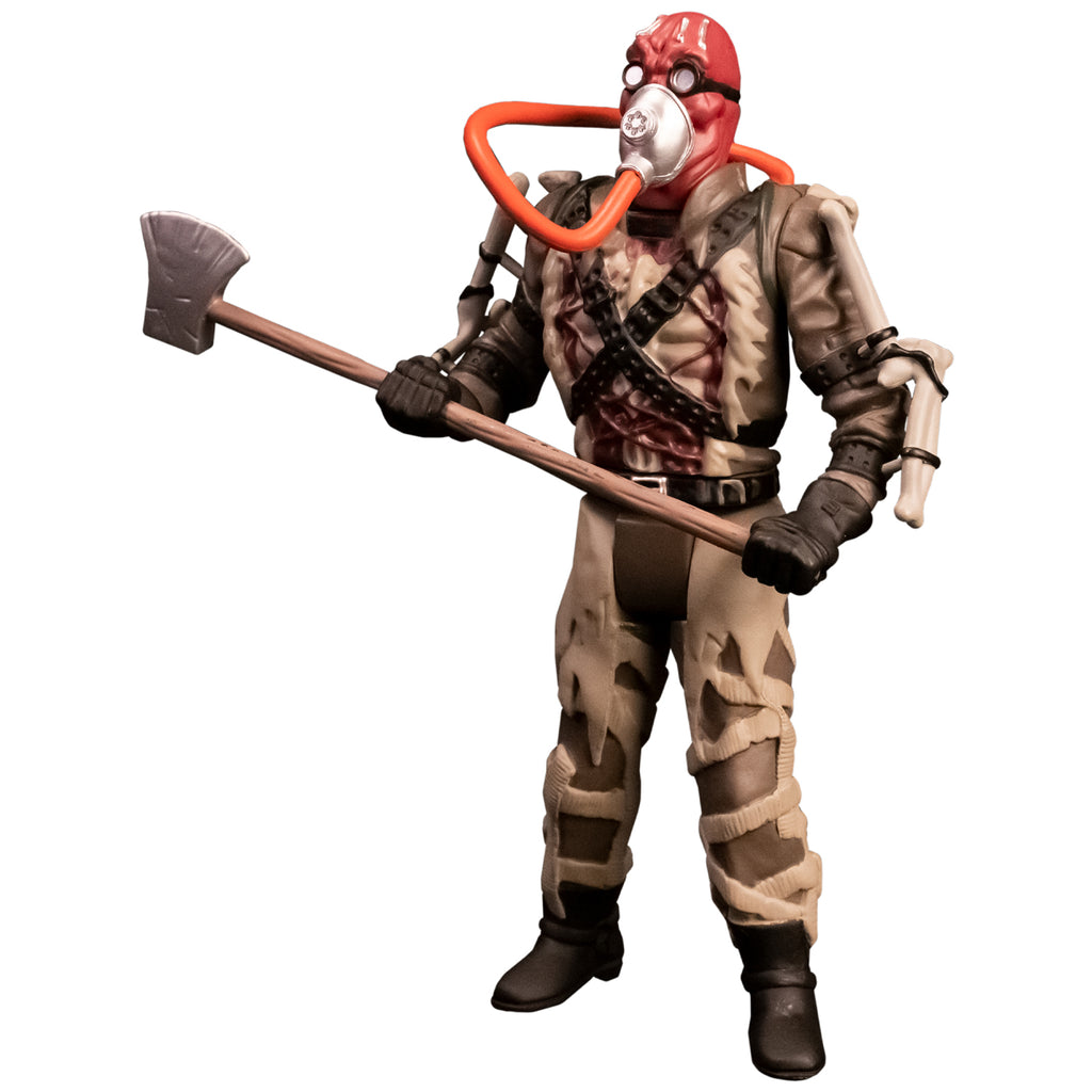 Action figure. left side view. Person with red head, wearing goggles and oxygen mask with orange hose. Tattered brown and tan outfit, apparatus attached to arms, ammunition belts across chest, black gloves and boots. Holding large Axe.