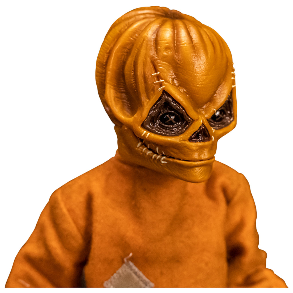 Right view. Close up of upper body and head of Trick 'r Treat Sam 1/6 scale figure with Sam Unmasked head. Head is Skull-like jack o' lantern face, stitches above eyes and sides of mouth, mouth closed in grin. Wearing orange footy pajamas