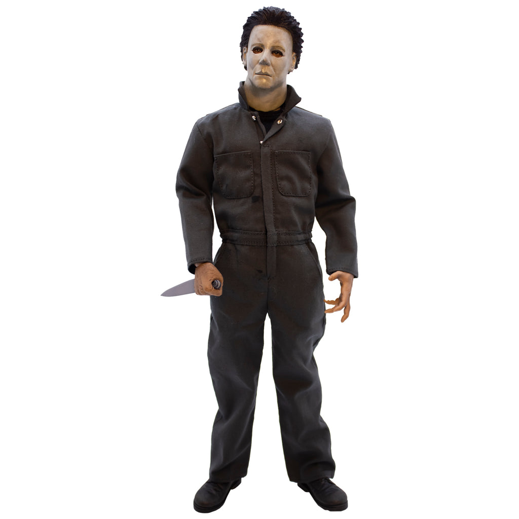 Halloween H20 Michael Myers 12" figure. White mask brown hair, wearing dark coveralls, black boots, holding butcher knife in right hand.