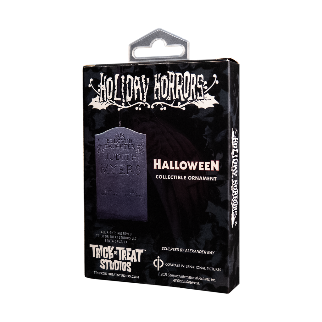 Product packaging, back,  black box, showing ornament. White text reads Holiday Horrors, Halloween, collectible ornament.  Manufacturing and licensing information