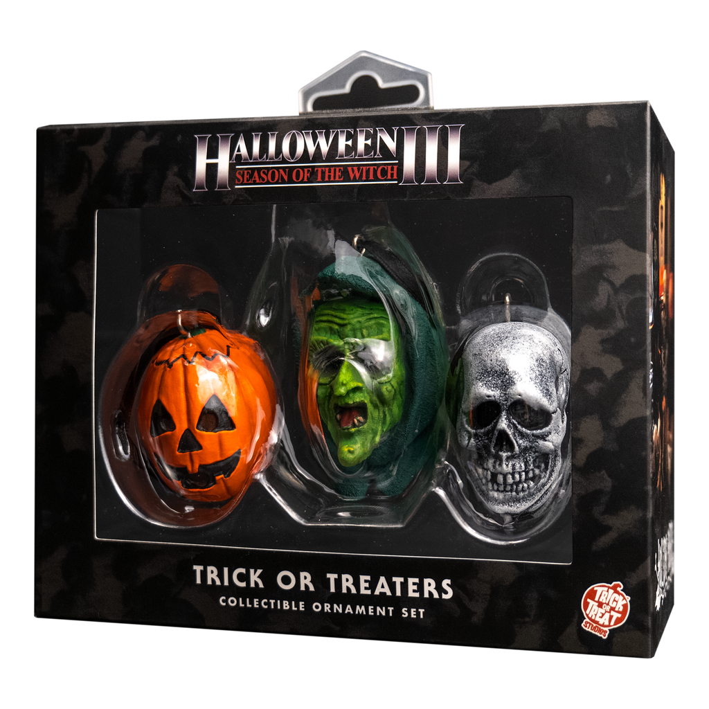 Product packaging.  Black window box, showing set of three ornaments.  text reads Halloween III Season of the Witch, Trick or Treaters, collectible ornament set.  Orange and white trick or Treat Studios logo.