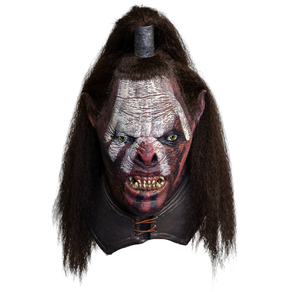 Mask, head and neck, front view. Orc, wrinkled skin with white and black war paint, pointed ears, snarling mouth with dirty sharp teeth. Green eyes. Long brown hair, top pulled into a ponytail.  Leather-like collar laced at neck.