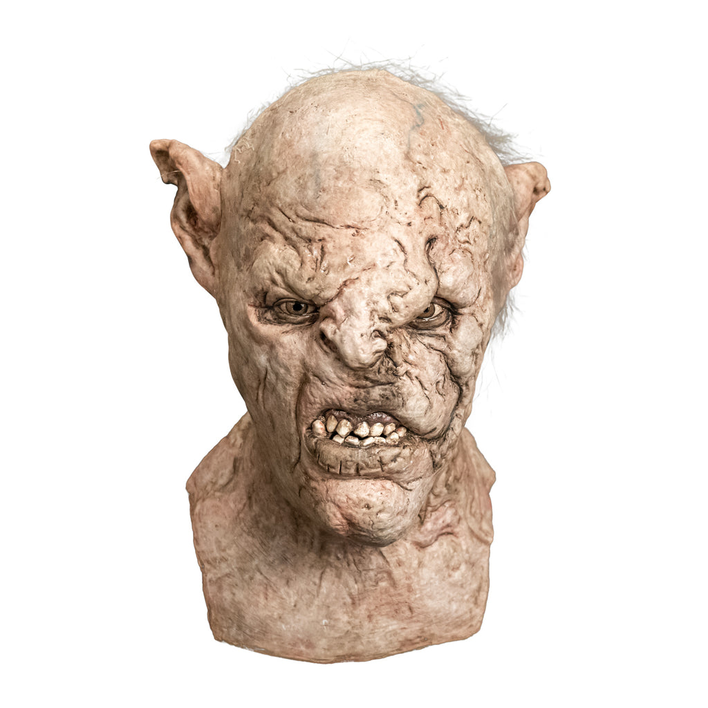 Mask, head, neck and upper chest, front view.  Orc, wrinkled pale skin, tattered high set pointed ears, scar above left eye down nose and side of snarling mouth.  Light brown eyes. Sparse gray hair on top and sides of head.