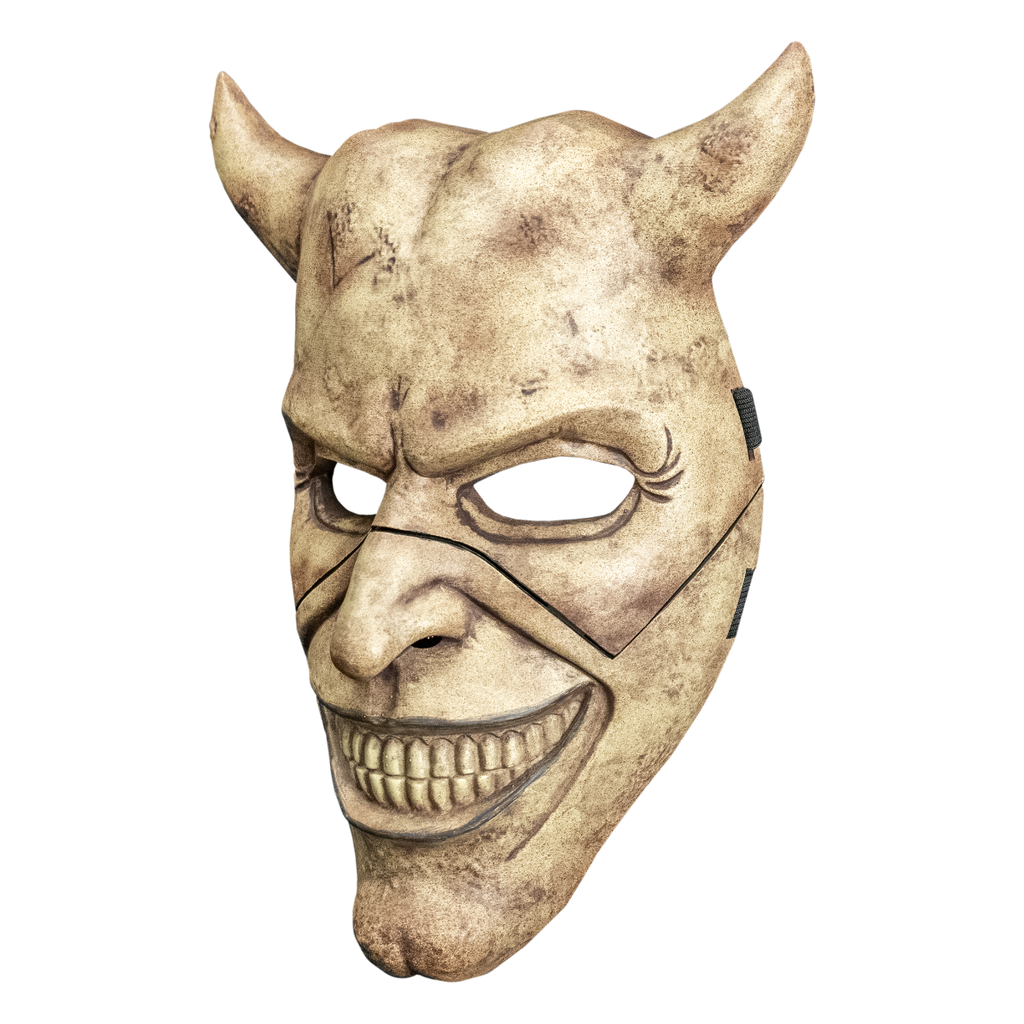 Grabber mask left side view. Face mask, dirty off-white and brown. Horns on both sides of head. Mouth in a toothy grin. Cleft chin.