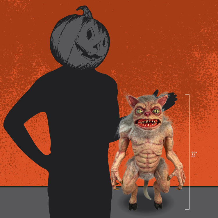 Person in black with jack o' lantern head, standing next to puppet prop to show size.  23 inches