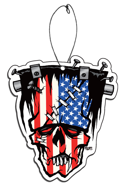 Air freshener. Illustration of Frankenstein-like monster face. Black hair with gray highlights, elongated forehead, flat head. Nails, screws and brackets in head, two metal posts on either side of head.  American flag superimposed over face. Large across forehead with several small bandages, wound on right cheek. Red eyes, no nose, down-turned mouth, sharp teeth. 