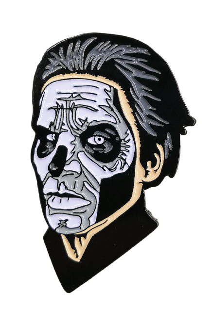 Enamel pin Head and neck. Thick black hair, white painted face, with black accents to create skull like appearance.