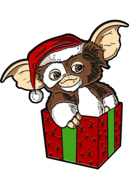Enamel pin. Gizmo, brown and white, wearing Santa hat, sitting in red and green gift box.