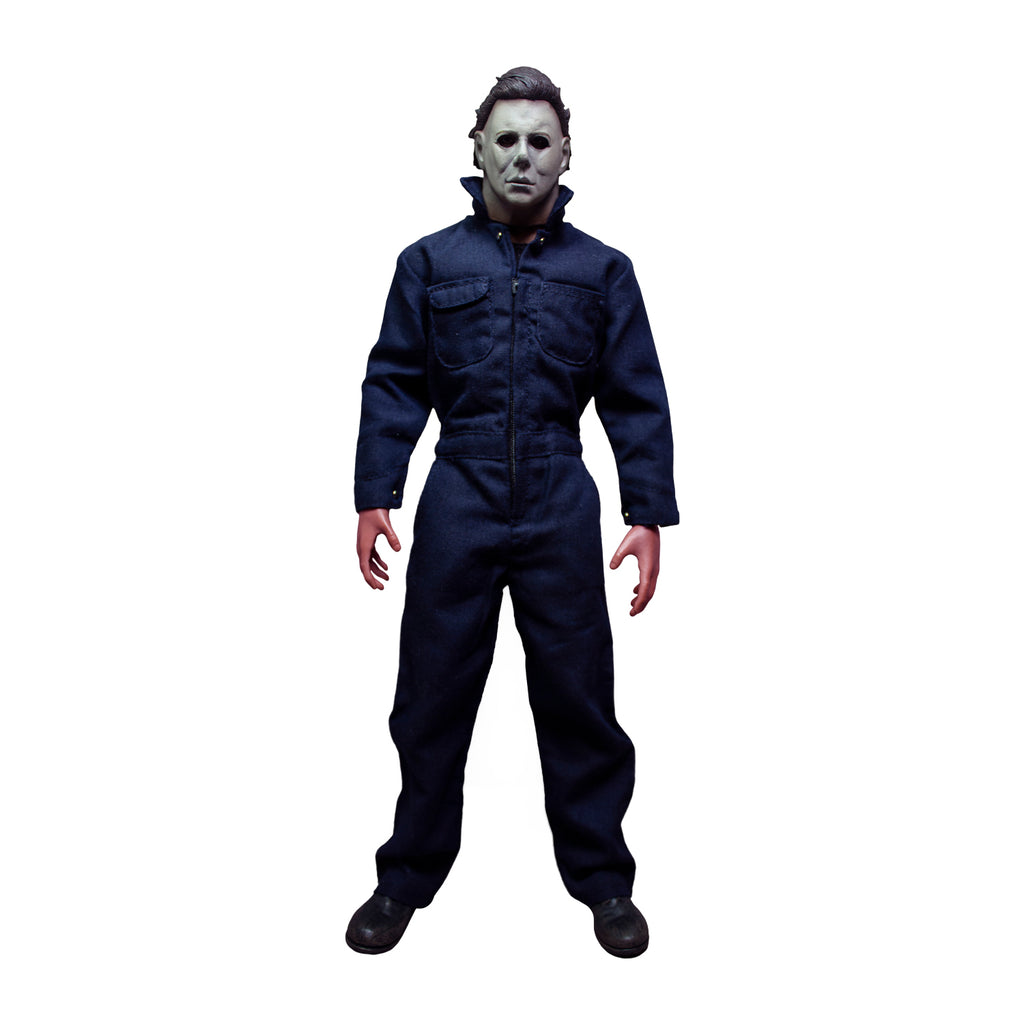 Michael Myers 12" figure. Front view. White mask, brown hair, wearing blue coveralls, black boots.