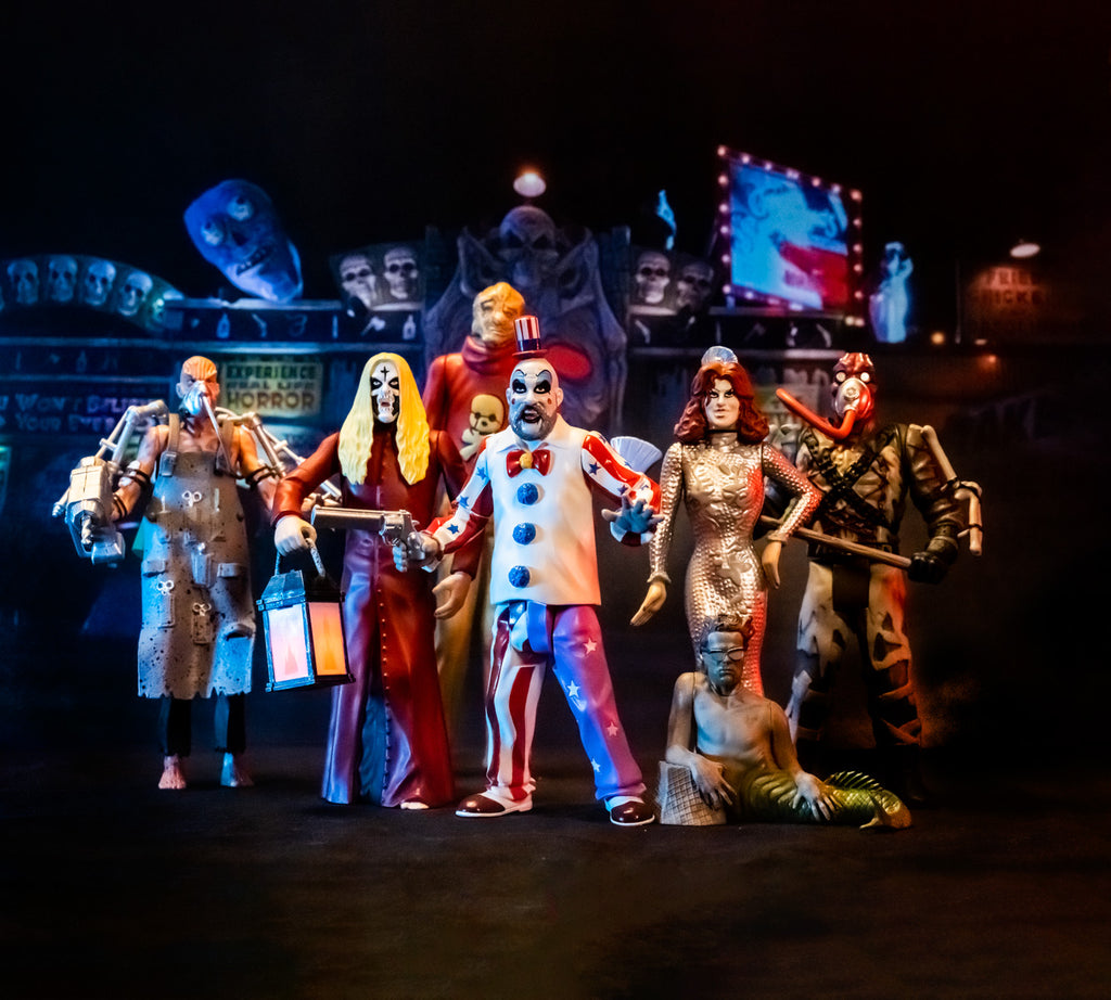 Dramatic lighting, circus background, full collection of House of 1000 Corpses action figures.