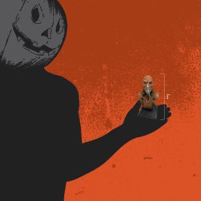 Orange background, person in black with a jack o' lantern head, holding bust to show size, 5 inches.