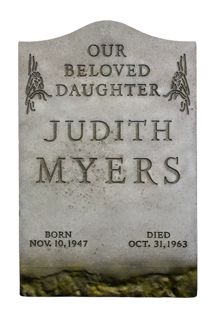 Halloween Judith Myers tombstone prop. Gray tombstone, text reads, Our Beloved Daughter, Judith Myers, Born Nov 10 1947, Died Oct 31 1963.