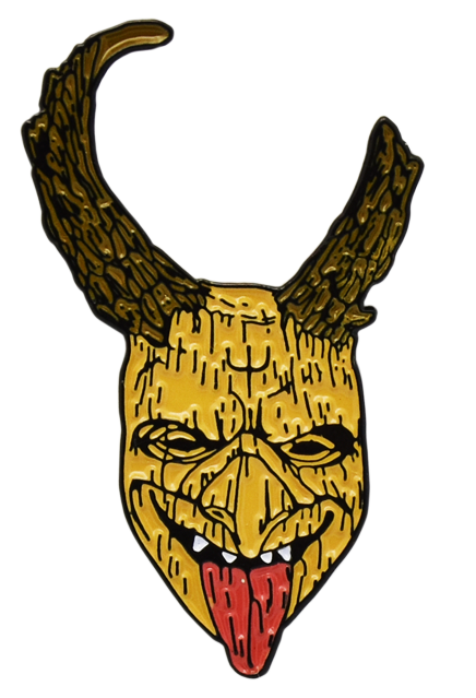 Enamel pin.  Wood textured elf face, with symbol on forehead, smiling showing teeth, tongue hanging out.  two antlers, left antler broken,