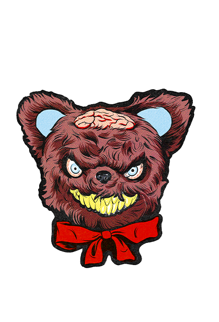 Wall decor.  Brown teddy bear head, menacing grin with yellow teeth, brains exposed on scalp, red bow on neck