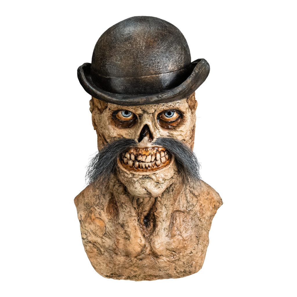 Front view. Dead Eye Mask, head neck and upper chest.  Skeletal grinning face with rotten flesh, grotesque teeth and gums.  Blue eyes, bushy moustache, wearing a black Bowler hat.