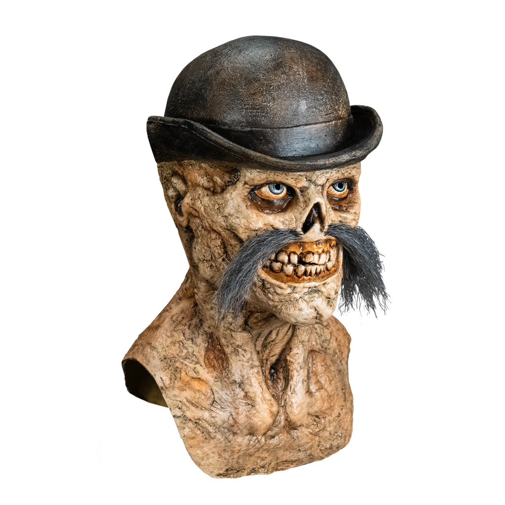 Right side view. Dead Eye Mask, head neck and upper chest. Skeletal grinning face with rotten flesh, grotesque teeth and gums. Blue eyes, bushy moustache, wearing a black Bowler hat.