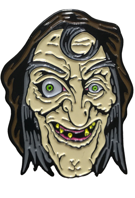 Enamel pin.  Wrinkled hag face, gray hair and eyebrows, brown hood.  Green eyes, right eye enlarged. Grin with sparse yellow teeth.