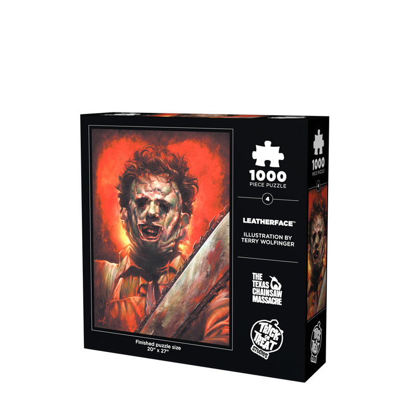 Leatherface jigsaw puzzle box, back side. Showing Leatherface holding chainsaw, wearing patchwork flesh mask, on orange background. White text reads 1000 piece puzzle, Leather face, Terry Wolfinger, The Texas Chainsaw Massacre. White Trick or Treat Studios logo.