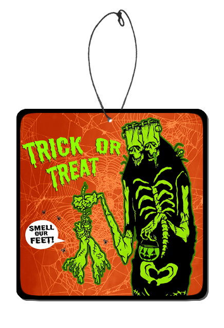 Air freshener.  Square orange background with spiderwebs. Bright green text reads Trick or treat! Two Headed, Skeletal Frankenstein-like monster holding decaying feet hanging from rope,  with word bubble reads Smell Our Feet.  Also holding small jack o' lantern candy pail in other hand.